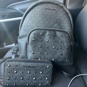 Selling a backpack and wallet set and a wristlet